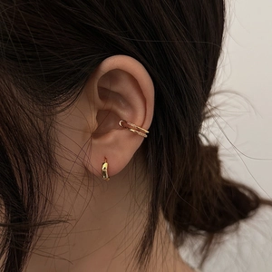 Gold-plated ear cuff and hoop set with micro-pave cubic zirconia on female model