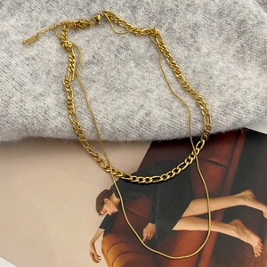 Close-up of double-layered gold snake bone chain necklace with lobster clasp