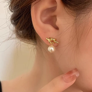 French vintage knotted gold stud earrings with elegant white round pearls for women