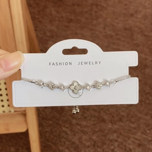 Bracciale a quadrifoglio d'argento con intarsio in conchiglia e catena regolabile da donna