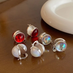 Elegant vintage-style glass bead earrings in red and iridescent white with silver settings