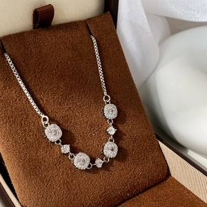 Macro view of sparkling cubic zirconia silver necklace on premium jewelry display