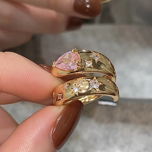 Gold-plated ring set featuring pink pear-cut zircon and starry engraving on hand