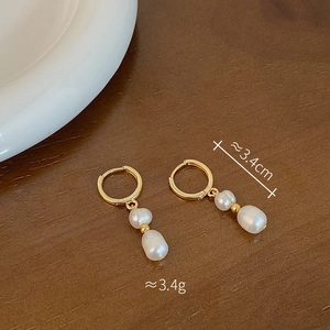 Detailed view of freshwater pearl drop earrings in gold finish with 3.4cm length info