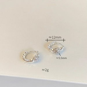 Detail view of silver earrings showing 12mm diameter and 5.5mm crystal ball measurements