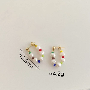 Detail view of colorful bead and freshwater pearl earrings with 2.5cm height dimension