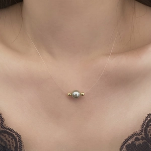 Minimalist grey pearl floating necklace on transparent line with gold beads for women