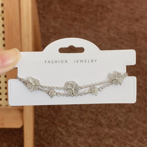 Silver double-layer bracelet with opal flower charms and crystals on fashion jewelry card