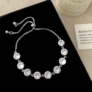 Elegant adjustable silver bracelet with nine round-cut sparkling cubic zirconia stones
