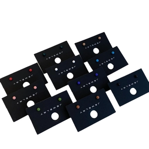 Colorful ball stud earrings set in various vibrant shades on a jewelry card