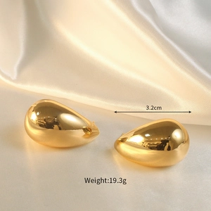 Polished gold teardrop earrings size 3.2cm and weight 19.3g detail on silk background