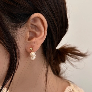 Elegant gold double pearl drop earrings featuring natural creamy white freshwater pearls