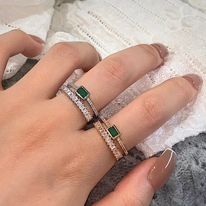 Elegant double-layered ring set with rectangular emerald green zircon in silver and gold