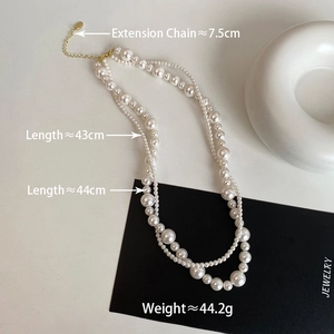 Collier double rang de perles avec fermoir doré et détails sur la longueur de chaîne