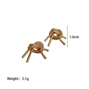 Detailed view of gold knotted stud earrings showing 1.6cm size and 3.1g weight