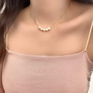 French luxury freshwater pearl necklace with five pearls on a delicate gold chain
