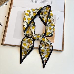 Fashionable lemon print skinny silk scarf with navy blue borders and fruity pattern