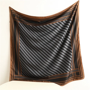 Close-up of geometric pattern and striped texture on a 90cm square silk scarf