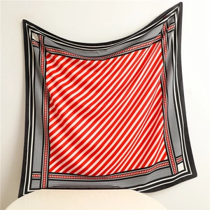 Detail of red and white striped twill silk scarf with houndstooth pattern border