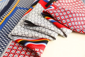 Macro shot of houndstooth silk scarf with colorful geometric patterns and fine texture