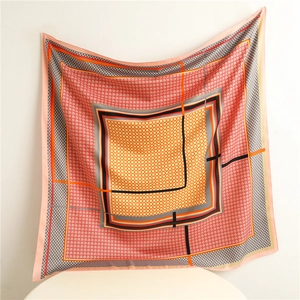 Detail of colorful houndstooth silk scarf with geometric pattern and smooth satin texture