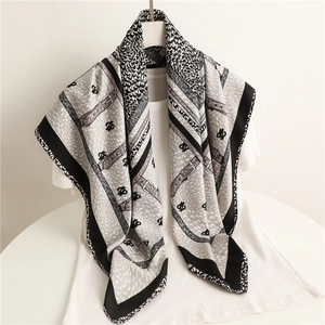 Black and white 90cm silk scarf with horse harness patterns and abstract feather prints