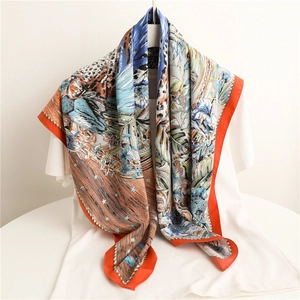 90cm silk scarf with tiger and tropical floral print, bright orange border draped style