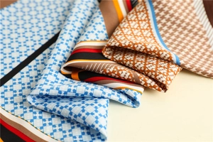 Macro detail of geometric houndstooth silk scarves with elegant patterned textures
