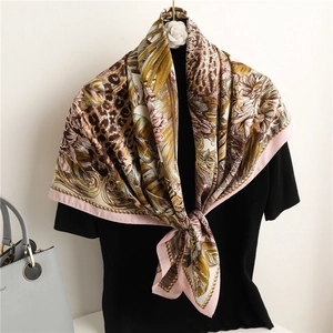 Silk leopard floral square scarf 90cm with pink border draped on a black model
