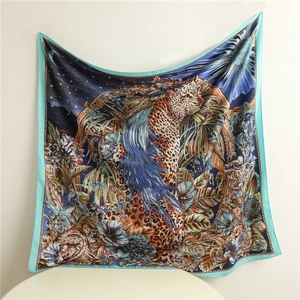 Detail showing tropical animal and celestial prints on a 90cm square silk scarf scarf