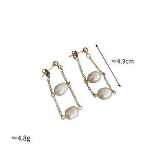 Detailed view of long gold chain earrings with natural freshwater pearls 4.3cm length