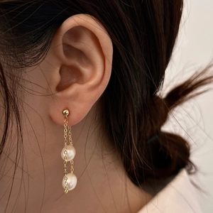Elegant long chain tassel earrings with two white pearls in gold-plated drop design