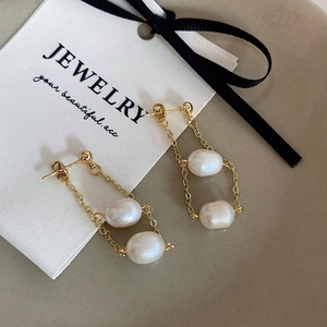 Elegant gold chain tassel earrings with freshwater pearls in a dual layered drop design