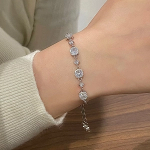 Sparkling silver cubic zirconia bracelet with adjustable chain on female wrist