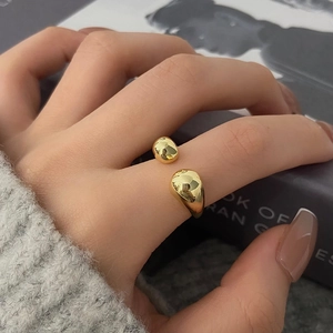 Minimalist gold overlapping open ring with polished teardrop design for women
