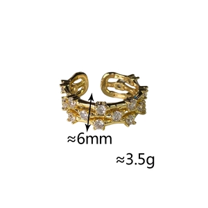 Close-up of triple-layer gold plated ring with micro-pave cubic zirconia settings