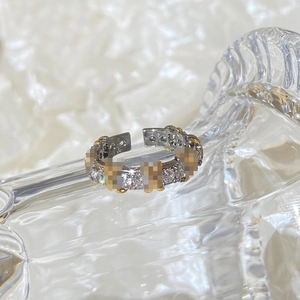 Macro shot of silver adjustable open ring with sparkling pavé micro-set cubic zirconia