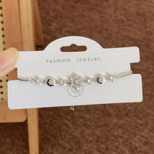 Elegant silver snowflake bracelet with micro-paved zircons and adjustable pull chain
