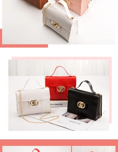Detail of lizard-pattern faux leather handbag with gold chain strap and stylish ring lock