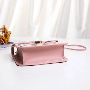 Pink daisy floral jelly crossbody bag with transparent PVC flap and gold twist lock clasp