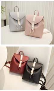 Detail of mini leather backpacks in four colors with drawstring and metal buckles