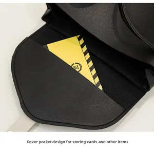Close-up of black litchi leather bag interior with a functional pocket for cards