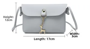 Detail showing grey faux leather mini bag with 17x12x3cm dimensions and deer charm