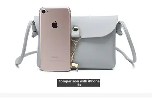 Mini grey deer charm phone bag shown with iPhone 6s for size reference and scale