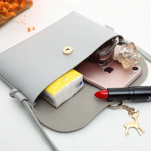 Light gray PU leather crossbody phone bag with gold deer charm and magnetic flap closure
