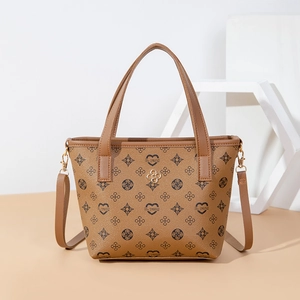 Retro brown monogram bucket bag with heart patterns and golden floral logo detail