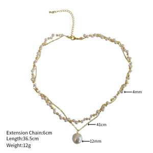 Detail view of double-layer pearl necklace with gold chain and large pearl pendant