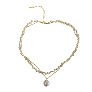 Double-layered gold pearl necklace featuring delicate strands and a pendant for women