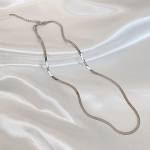 Detail of silver flat snake bone chain with lobster clasp and adjustable link extension
