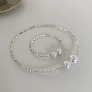 Elegant silver textured metal choker and bracelet set with white pearl accents